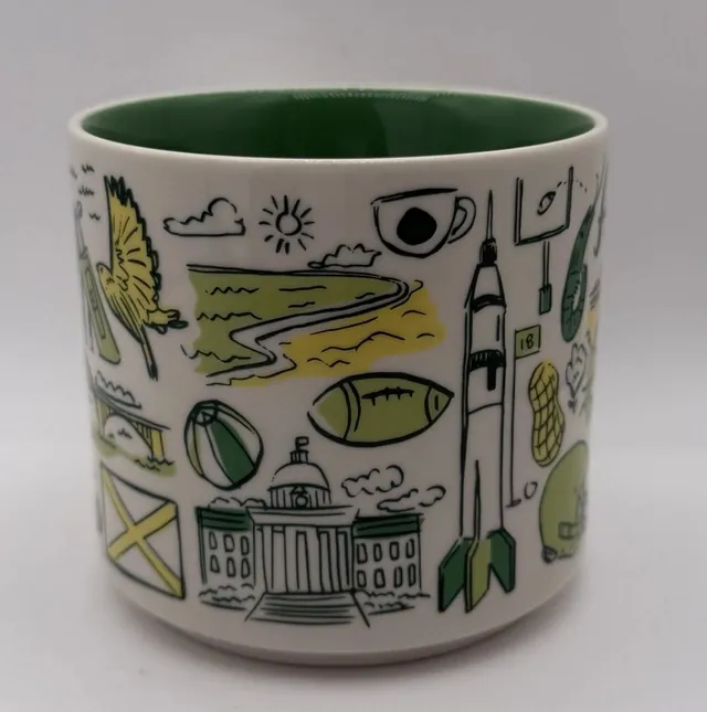 Starbucks Been There Series Alabama mug with Alabama in green script, THE COTTON STATE, a waterfall, a yellow plane and a sailboat — side view