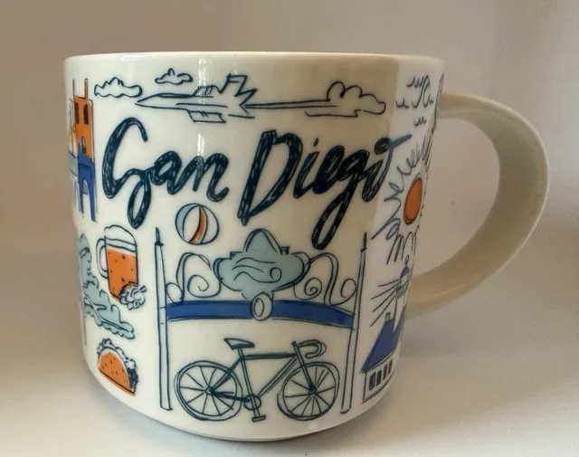 Starbucks Been There Series San Diego mug with San Diego in blue script, a bicycle, a beer glass, a taco and a blue horse