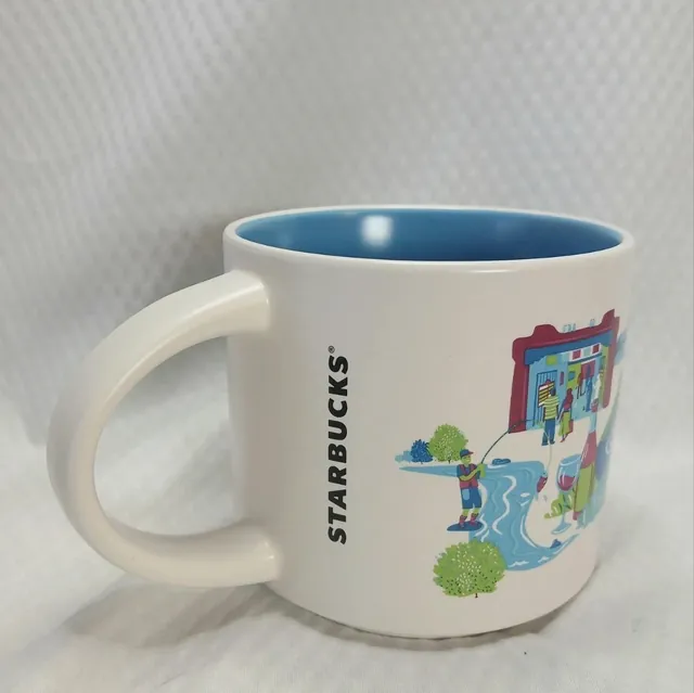 Starbucks Discovery Series Albuquerque mug with hot air balloons, a lizard, a prickly pear cactus and a dancer around the word ALBUQUERQUE — back view