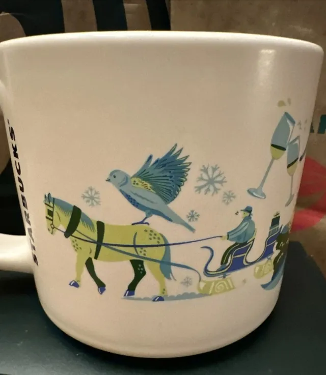 Starbucks Discovery Series Aspen mug with ski gondolas, a hot air balloon and snowy mountains around the word ASPEN — back view