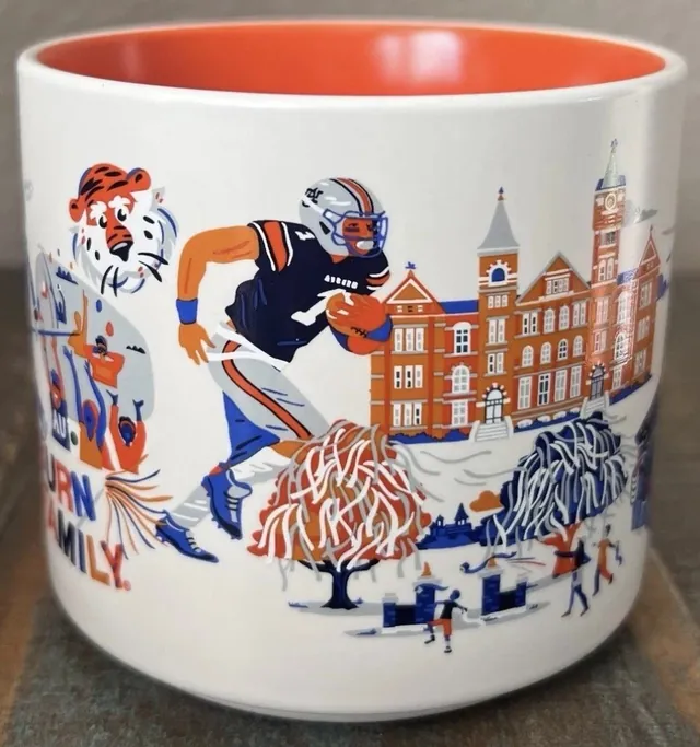 Starbucks Discovery Series Auburn University mug in its Campus Collection box with an eagle, a mascot with a flag, a stadium and a brick hall — side view
