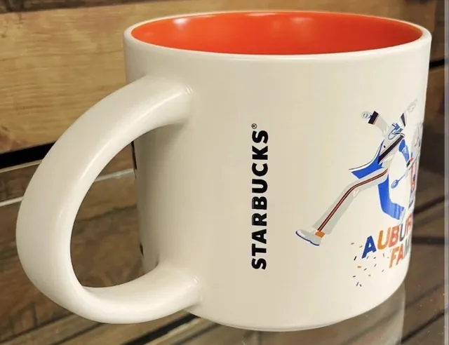 Starbucks Discovery Series Auburn University mug in its Campus Collection box with an eagle, a mascot with a flag, a stadium and a brick hall — back view
