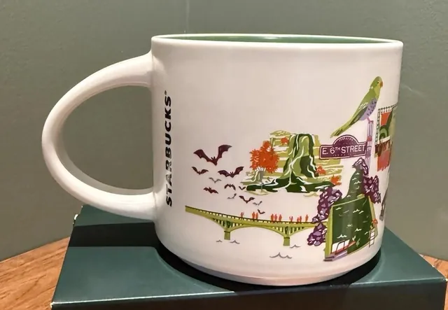 Starbucks Discovery Series Austin mug with a skyline, an armadillo, wildflowers and paddleboarders around the word AUSTIN — back view