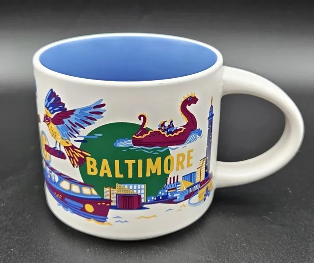 Starbucks Discovery Series Baltimore mug with a bird, a paddle boat and a ship around the word BALTIMORE and a blue inside