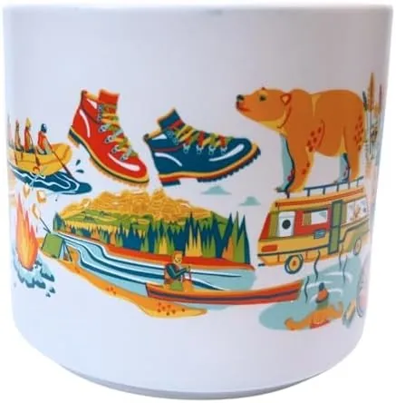 Starbucks Discovery Series Banff mug with a bighorn sheep, a mountain bike and a camper van around the word BANFF and an orange inside — side view