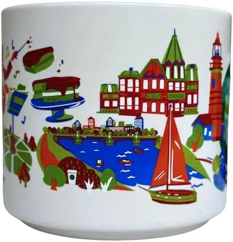 Starbucks Discovery Series Boston mug with a shamrock, a red lighthouse, a lobster and a columned building around the word BOSTON — side view
