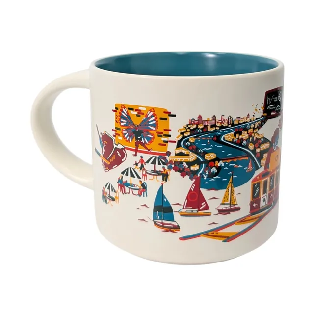 Starbucks Discovery Series Cambridge mug with row houses, a weeping willow, a duck and rowers around the word CAMBRIDGE — back view