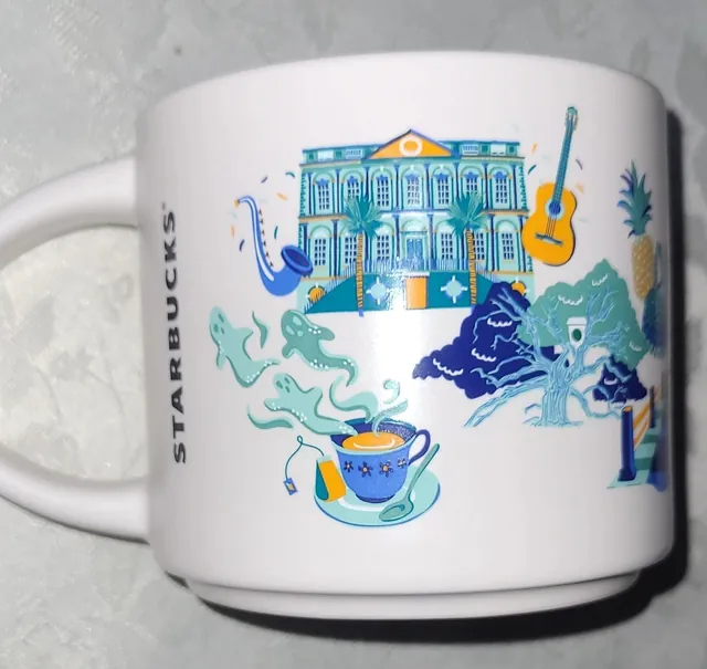 Starbucks Discovery Series Charleston mug with a paddleboarder, a heron, pastel row houses and a horse-drawn carriage around the word CHARLESTON — back view