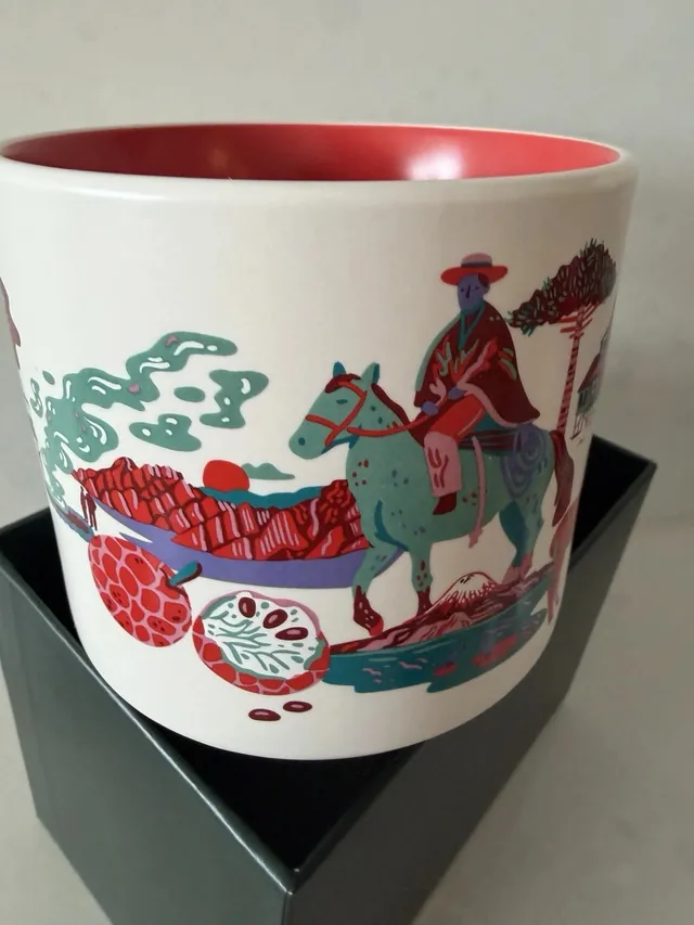 Starbucks Discovery Series Chile mug with a condor, a wine glass, a hiker and red mountains around the word CHILE — side view