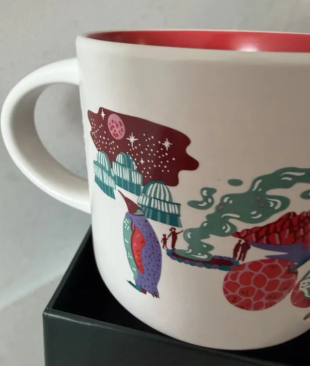 Starbucks Discovery Series Chile mug with a condor, a wine glass, a hiker and red mountains around the word CHILE — back view