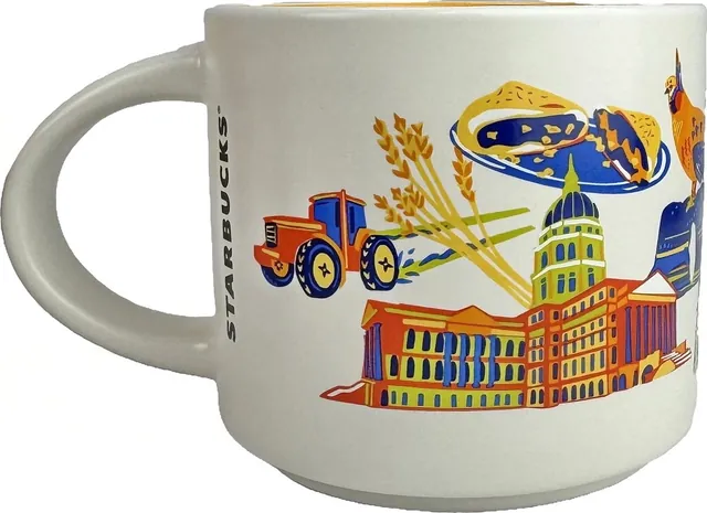 Starbucks Discovery Series Kansas mug with a sunflower, blue bison, riders on horseback, farmhouse and windmill around the word KANSAS — back view