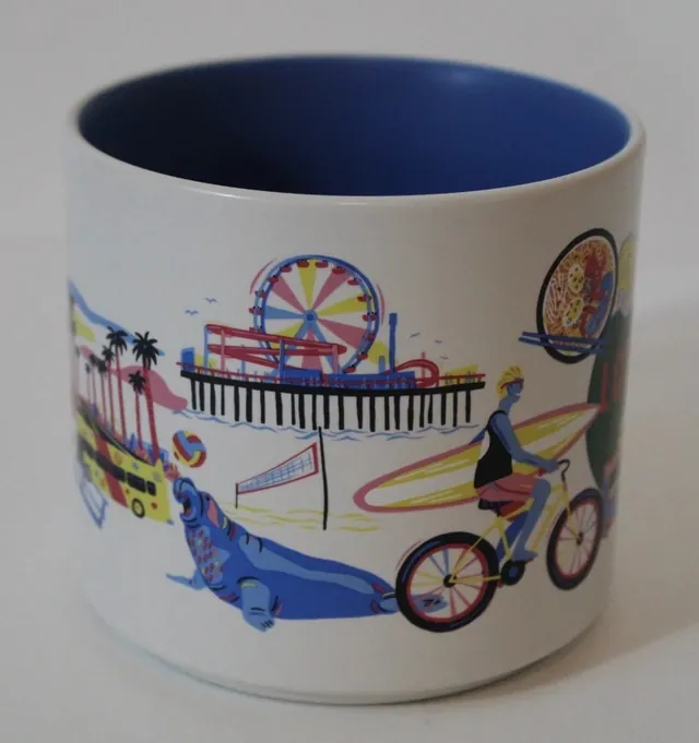 Starbucks Discovery Series Los Angeles mug with a film reel, a movie camera and a food truck around the words LOS ANGELES — side view