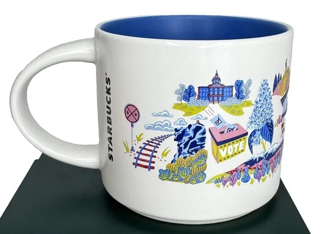Starbucks Discovery Series New Hampshire mug with a red canoe, maple syrup bottle and ski poles around the words NEW HAMPSHIRE — back view