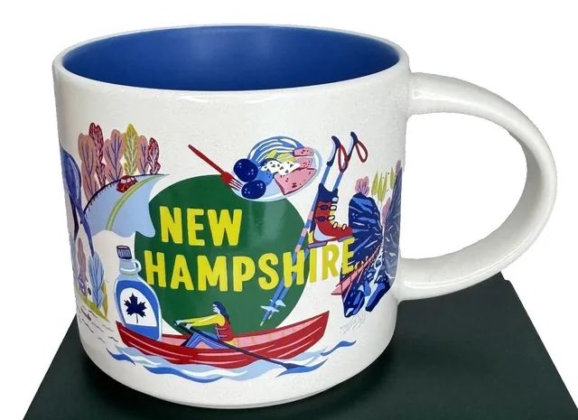 Starbucks Discovery Series New Hampshire mug with a red canoe, maple syrup bottle and ski poles around the words NEW HAMPSHIRE