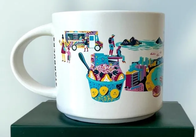 Starbucks Discovery Series Oahu mug with a plumeria flower, snorkeler and surfboards around the word OAHU — back view