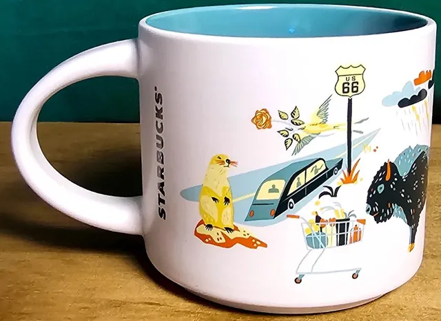 Starbucks Discovery Series Oklahoma mug with a windmill, oil derrick, hillside building and a woman holding a platter around the word OKLAHOMA — back view