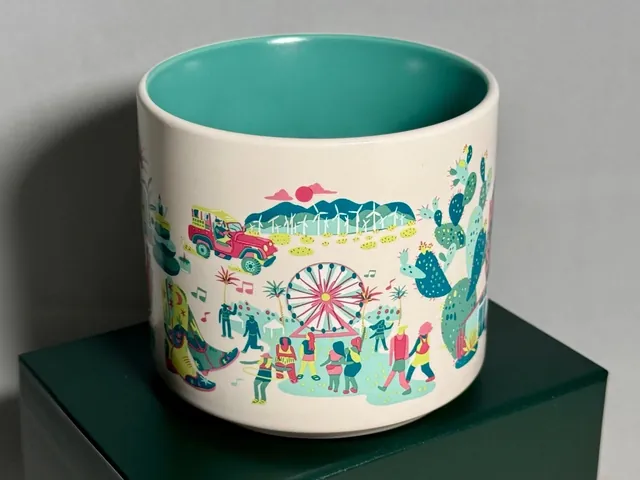 Starbucks Discovery Series Palm Springs mug with a tennis player, golf bag and cactus around the words PALM SPRINGS — side view