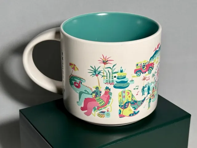 Starbucks Discovery Series Palm Springs mug with a tennis player, golf bag and cactus around the words PALM SPRINGS — back view