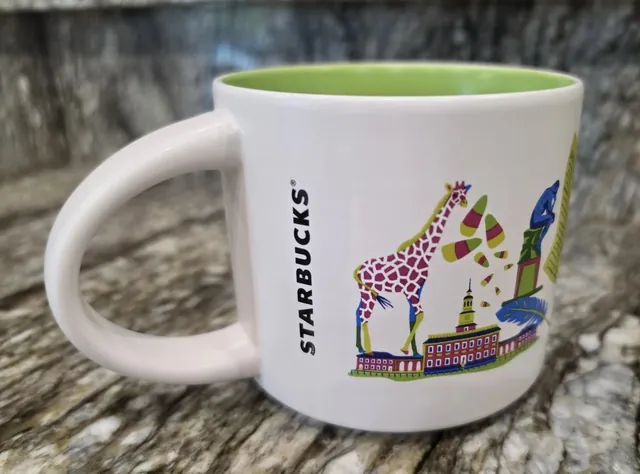 Starbucks Discovery Series Philadelphia mug with a loaded sandwich, a boxer in pink gloves and a pink skyline around the word PHILADELPHIA — back view