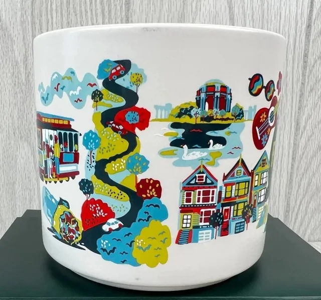 Starbucks Discovery Series San Francisco mug with a red suspension bridge, a ferry, a pelican and hillside houses around the words SAN FRANCISCO — side view