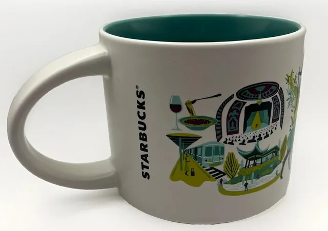 Starbucks Discovery Series Staten Island mug with a sea turtle, a suspension bridge, a ferry and a lobster around the words STATEN ISLAND — back view