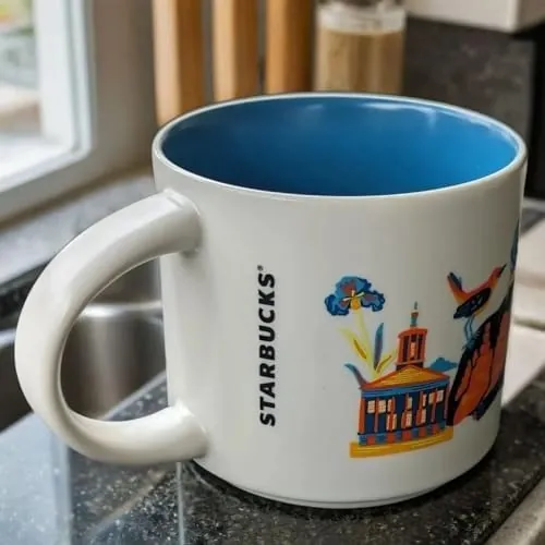 Starbucks Discovery Series Tennessee mug with a black bear, vinyl records, a rack of ribs and a waterfall around the word TENNESSEE — back view