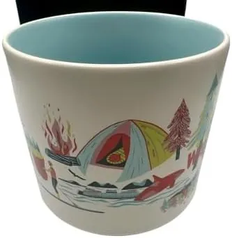 Starbucks Discovery Series Washington mug with a salmon, a red apple, a snowy mountain and a Bigfoot-style figure around the word WASHINGTON — side view