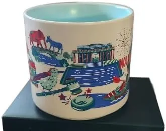 Starbucks Discovery Series Washington, D.C. mug with fireworks, a kayaker, a white columned building and a blue bird around the name — side view