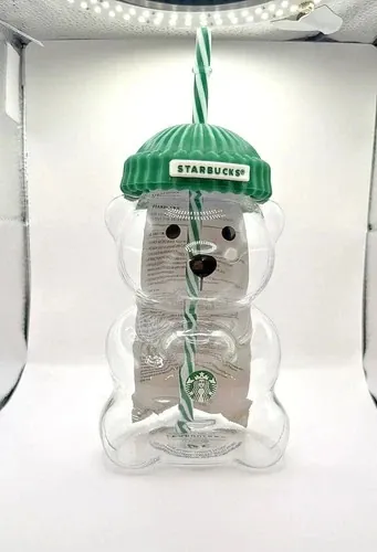 Starbucks Bearista original glass cold cup, a bear-shaped glass cup with a green ribbed beanie lid and a striped straw