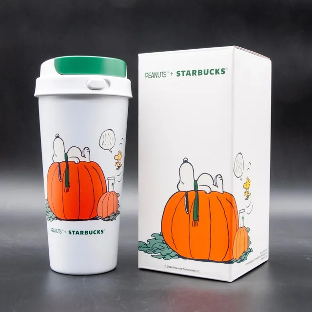 Starbucks Peanuts Great Pumpkin tumbler, white with Snoopy asleep on a pumpkin, next to its gift box