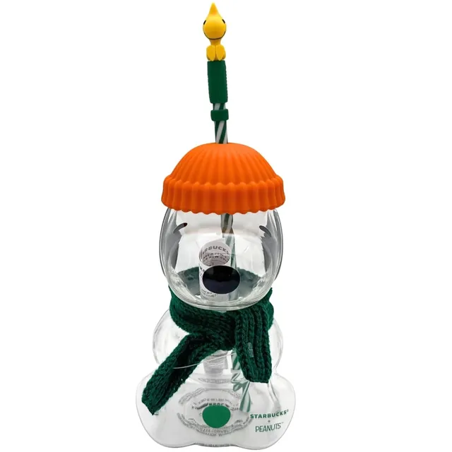 Starbucks Peanuts Snoopy glass cold cup with orange beanie lid, green scarf and Woodstock straw topper