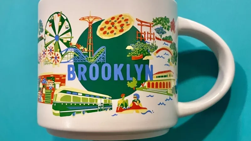 Brooklyn Starbucks mug featuring Coney Island, a ferris wheel, roller coaster, Nathan’s hot dog stand, subway train, and street market.