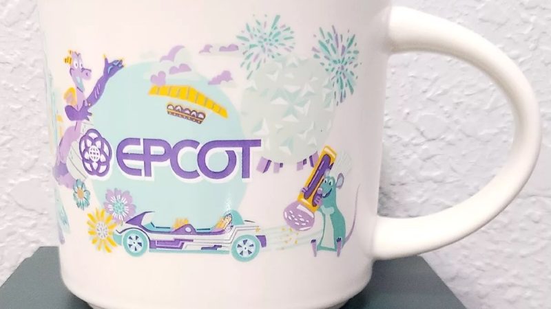 Epcot Starbucks mug with images of a purple dragon, fireworks, futuristic buildings, and space-themed illustrations.