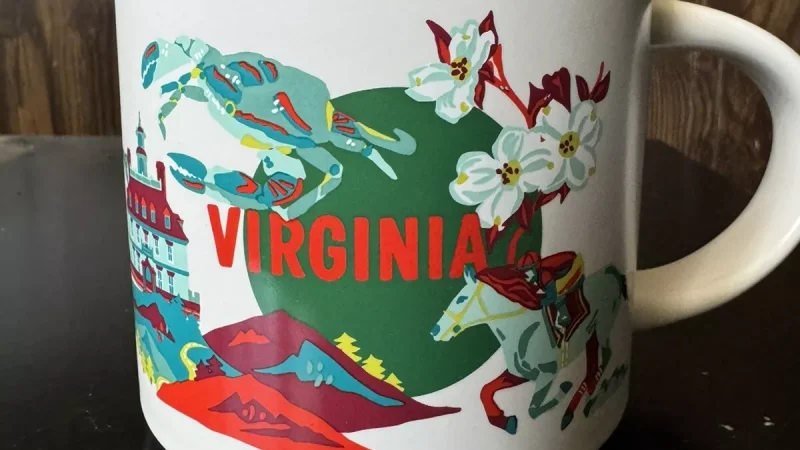 Virginia Starbucks mug displaying seafood, historical buildings, mountains, and beach scene.