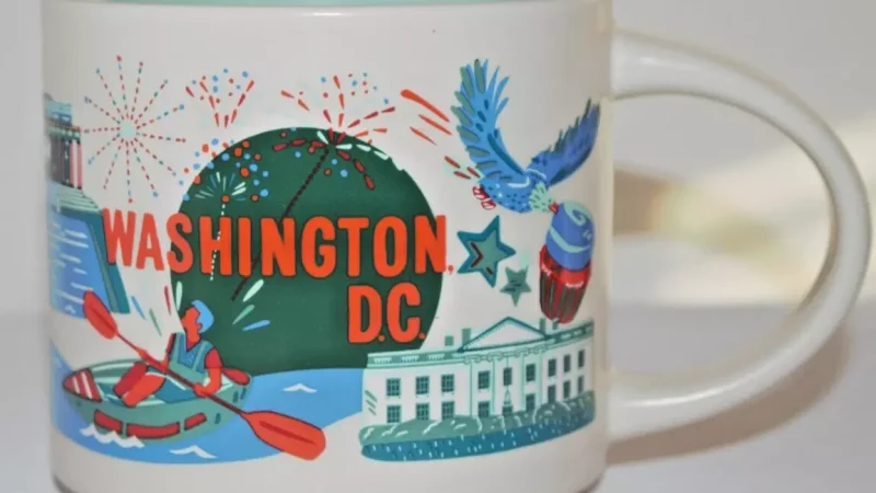 Washington D.C. Starbucks mug with images of the White House, fireworks, bald eagle, and political animals.