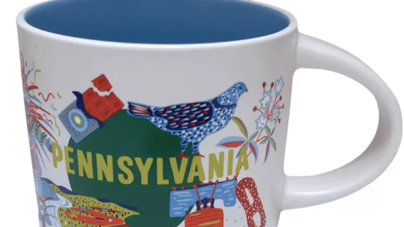 Pennsylvania Starbucks mug with images of the Liberty Bell, pretzel, ruffed grouse, and colorful bird.