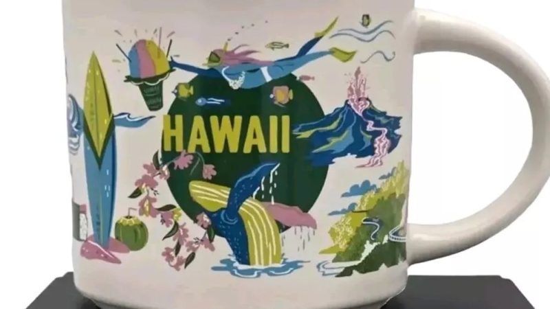 Hawaii Starbucks mug displaying a surfboard, hula dancer, volcano, whales, and tropical flowers.