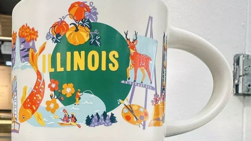 Illinois Starbucks mug with images of koi fish, pumpkins, corn stalks, Route 66, and artistic symbols.