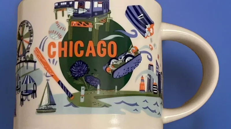 Chicago Starbucks mug with images of an elevated train, baseball, deep-dish pizza, Navy Pier ferris wheel, and musical instruments.